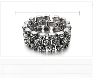 Macro detail of 31mm wide stainless steel bracelet showing intricate scroll engravings