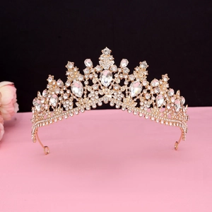 Detail of baroque gold crown with crystal rhinestones for bridal wedding luxury style