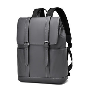 Dark grey minimalist travel laptop backpack with dual magnetic buckles and wide straps