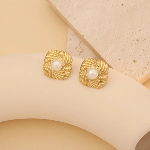 Elegant gold square stud earrings featuring a central white pearl in vintage shell-like style