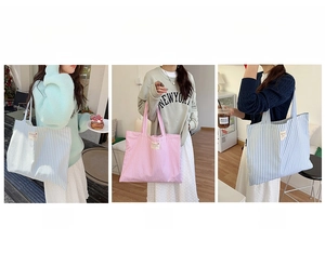 Detailed views of striped canvas tote bags in green, pink and blue color variants