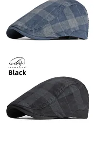 Detail view of British style plaid flat caps in blue-grey and black corduroy fabric