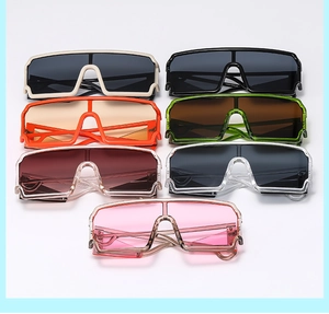 Detailed view of oversized shield sunglasses in multiple vibrant colors, modern fashion eyewear.