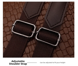 Close-up of adjustable strap with crocodile pattern leather and gunmetal buckle