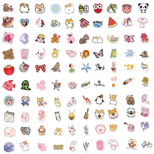 Flat lay of cute waterproof stickers featuring shiba inu and panda for DIY decoration