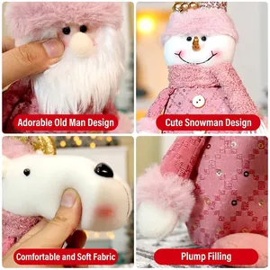 Pink Christmas plush collection featuring Santa, snowman, and reindeer soft holiday dolls
