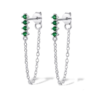 Detail of S925 sterling silver S-shaped earrings with green zircons and long tassels