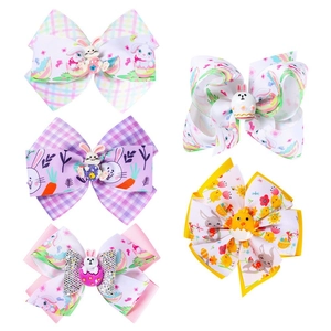 Detail of five handmade Easter hair bows with cute 3D bunny and chick centerpieces
