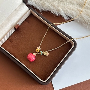 Exquisite 18k gold plated necklace with a red apple pendant inside a premium jewelry box