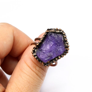 Vintage purple agate druzy geode ring with bronze beaded bezel setting on white background