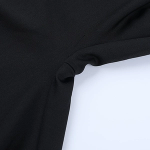 Close-up of durable reinforced stitching and premium black knit fabric texture