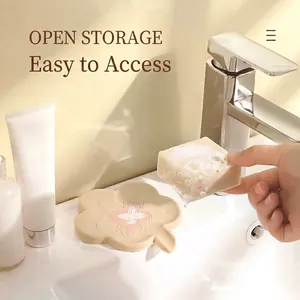Minimalist flower-shaped silicone soap holder with open storage design for bathroom use