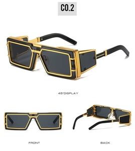 Detail view of punk style sunglasses with gold geometric frames and black lenses