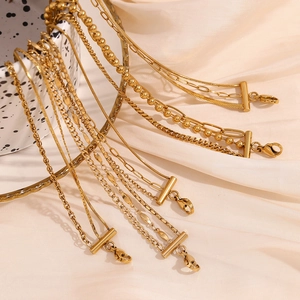 Three-layer 18K gold plated stainless steel anklet chain set on elegant satin fabric