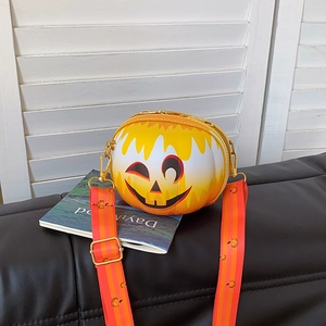 Detail of pumpkin-shaped crossbody bag with orange gradient finish and wide floral strap