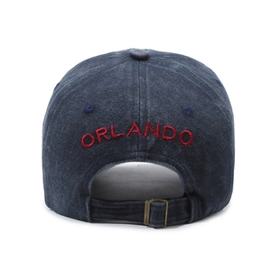 Vintage washed navy cotton baseball cap featuring red Orlando embroidery and metal buckle