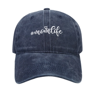 Vintage washed dark blue denim baseball cap featuring white #momlife script and heart motif