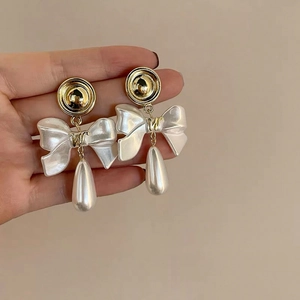 Elegant gold flower pearl earrings with silk ribbon bow and teardrop drop pendants