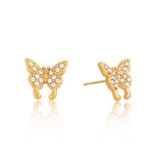 Detailed view of gold butterfly stud earrings with sparkling crystal pavé on white background