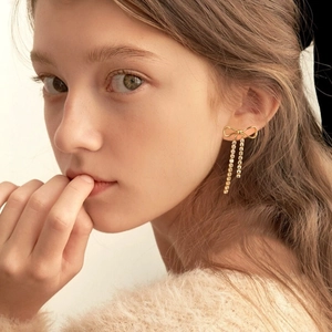 Elegant 18k gold stainless steel bow earrings with sparkling diamond tassel chains
