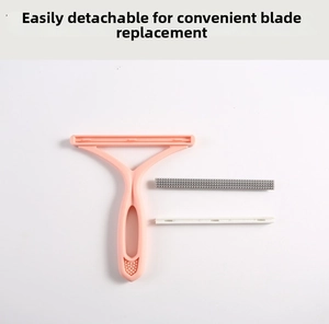 Detail showing the detachable pink handle and two interchangeable lint scraper heads