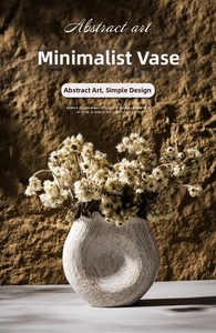 Detailed texture of white ceramic vase with natural wabi-sabi handmade grain and dried flowers