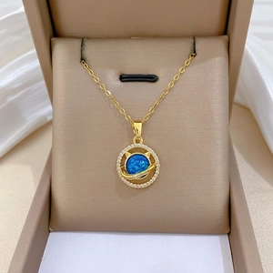 Elegant gold titanium steel necklace with blue celestial opal pendant and sparkling zircons