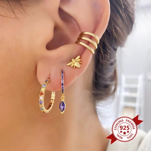 S925 silver needle gold earrings set with colorful zircon stones on model ear
