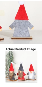 Detail of Christmas gnomes with felt hats and faux fur beards on stable wooden bases