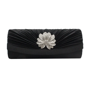 Elegant black satin pleated evening clutch with a sparkling silver rhinestone flower