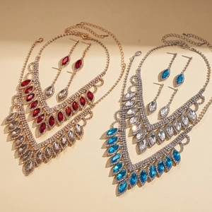Luxury rhinestone teardrop tassel necklace and earring set with marquise cut crystals
