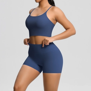Detail shot showing the high elasticity of navy blue yoga set fabric and seamless waistband