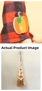 Detail of autumn gnome with red plaid hat and pumpkin decor hanging on a wall