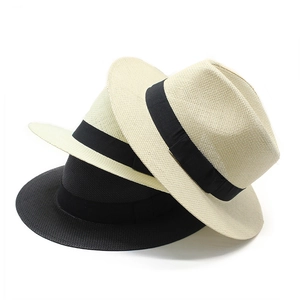 Handwoven straw Panama hats with black ribbon bands in beige and black colors for sun protection
