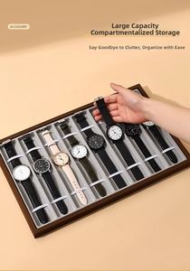 Close-up of a 10-slot walnut wood watch tray with soft grey velvet and securing straps