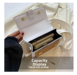Internal view of the bicolor crossbody bag showing storage space for phone and wallet
