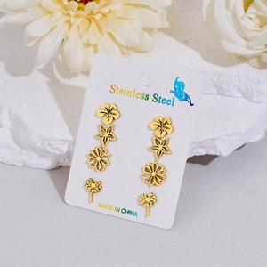 Set of 4 pairs of gold stainless steel stud earrings with flower and star designs