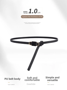 Detail of 1.0cm black slim belt showing gold oval buckle on smooth cowhide texture