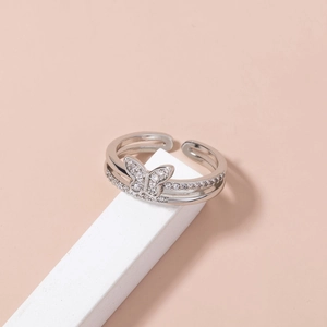 Macro shot of silver butterfly ring with micro-pave white zircon and open double band