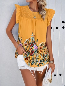 Detailed view of yellow floral sleeveless top featuring ruffled edges and casual style