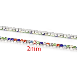 Detailed close-up of 2mm rainbow crystal tennis chain with silver metal base settings