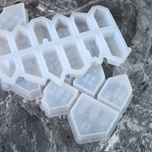 Detailed view of translucent silicone house molds for resin and candle making ornaments