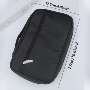 Portable black zippered makeup brush organizer bag with side handle for travel and studio