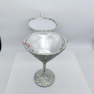 Detail of silver martini crystal bag with rhinestone inlay and magnetic clasp closure