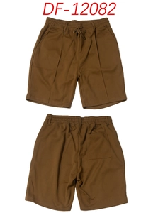 Detail of brown knit leisure shorts showing elastic drawstring waist and pocket texture