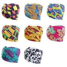 Detail view of African print knot headbands in 8 colorful geometric fabric patterns