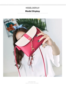Chic pink and white contrast mini crossbody bag with gold deer pendant shown on model