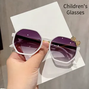 Kids polygon sunglasses with white frame, purple gradient lenses and gold bow decoration