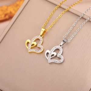Double heart pendant necklace in gold and silver finish with white zircon inlay