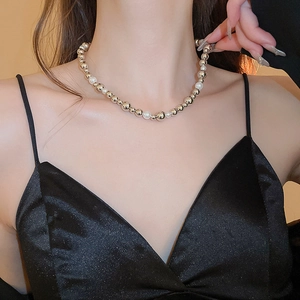 Metallic gold beads and white faux pearls choker necklace for women on neck display